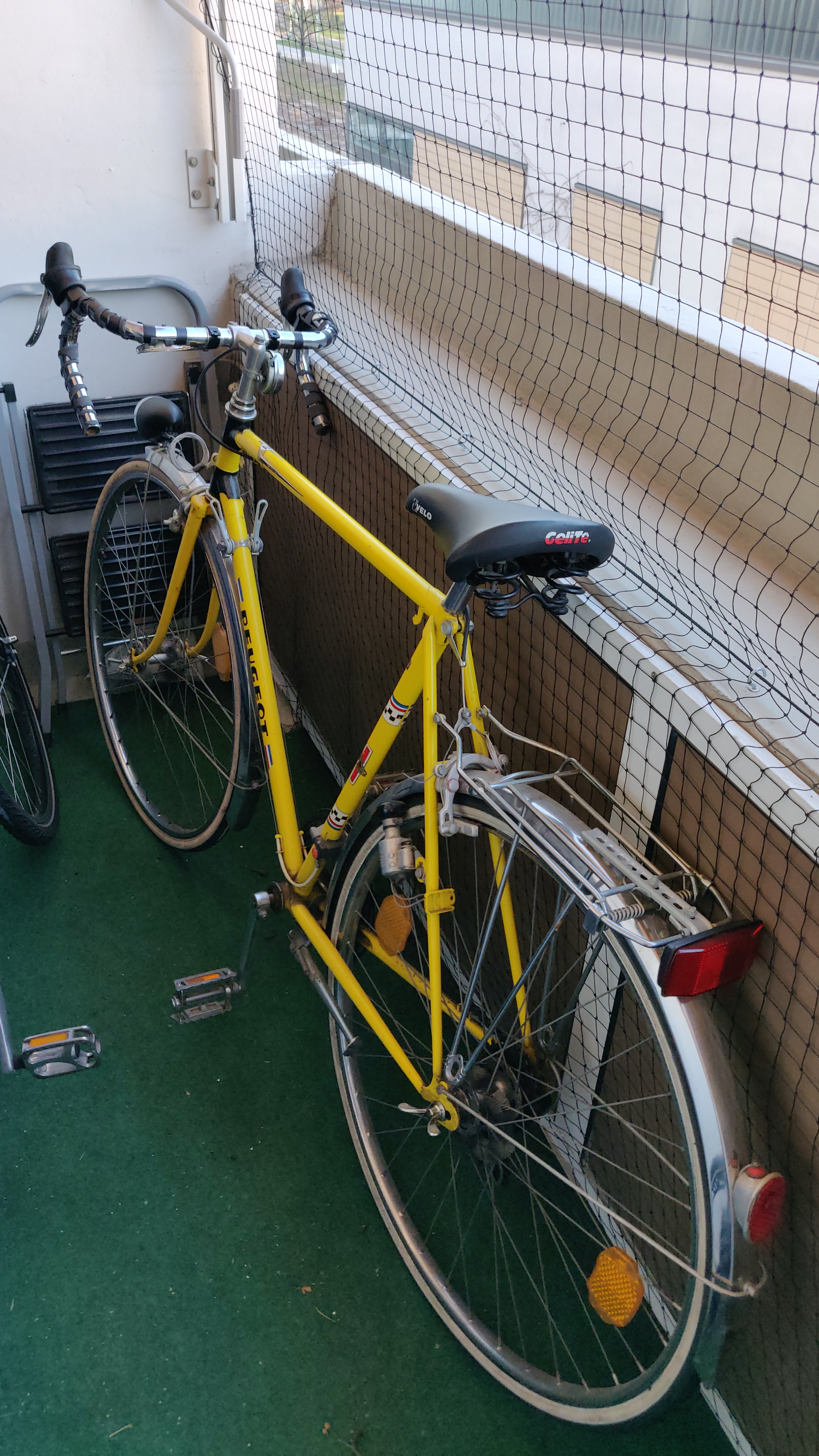 full picture of the bike standing on the balcony, bar tape already removed